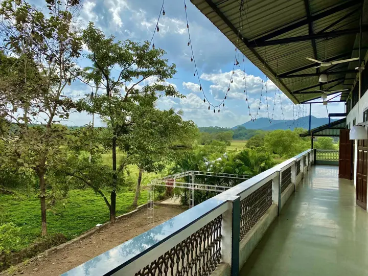 The verandah looks out over the fields and hills